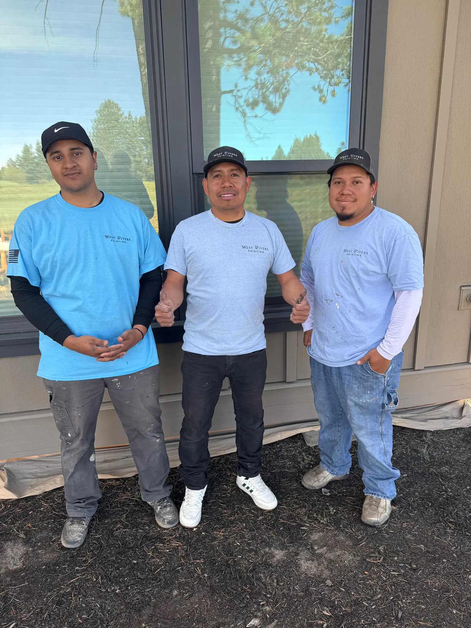 West Rivers Painting crew members in uniform at completed exterior painting project in Central Oregon
