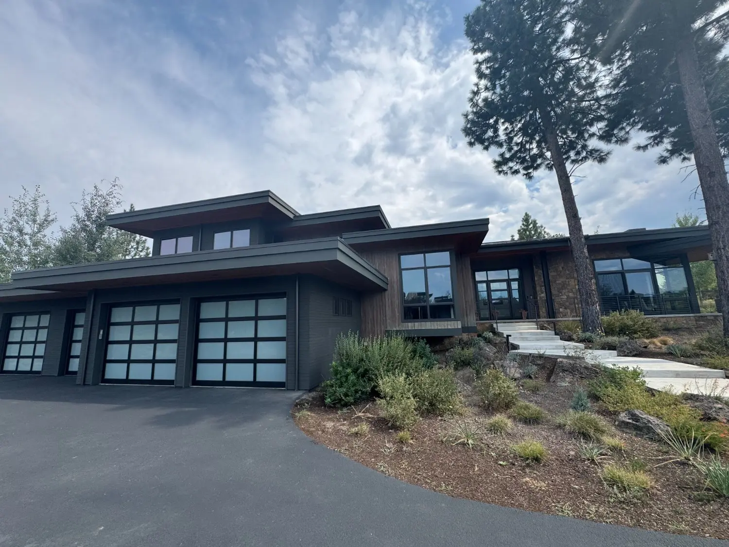 A professional exterior painting and siding renovation on a contemporary residential home in Bend, OR, featuring clean lines, modern finishes, and quality craftsmanship by West Rivers Painting.