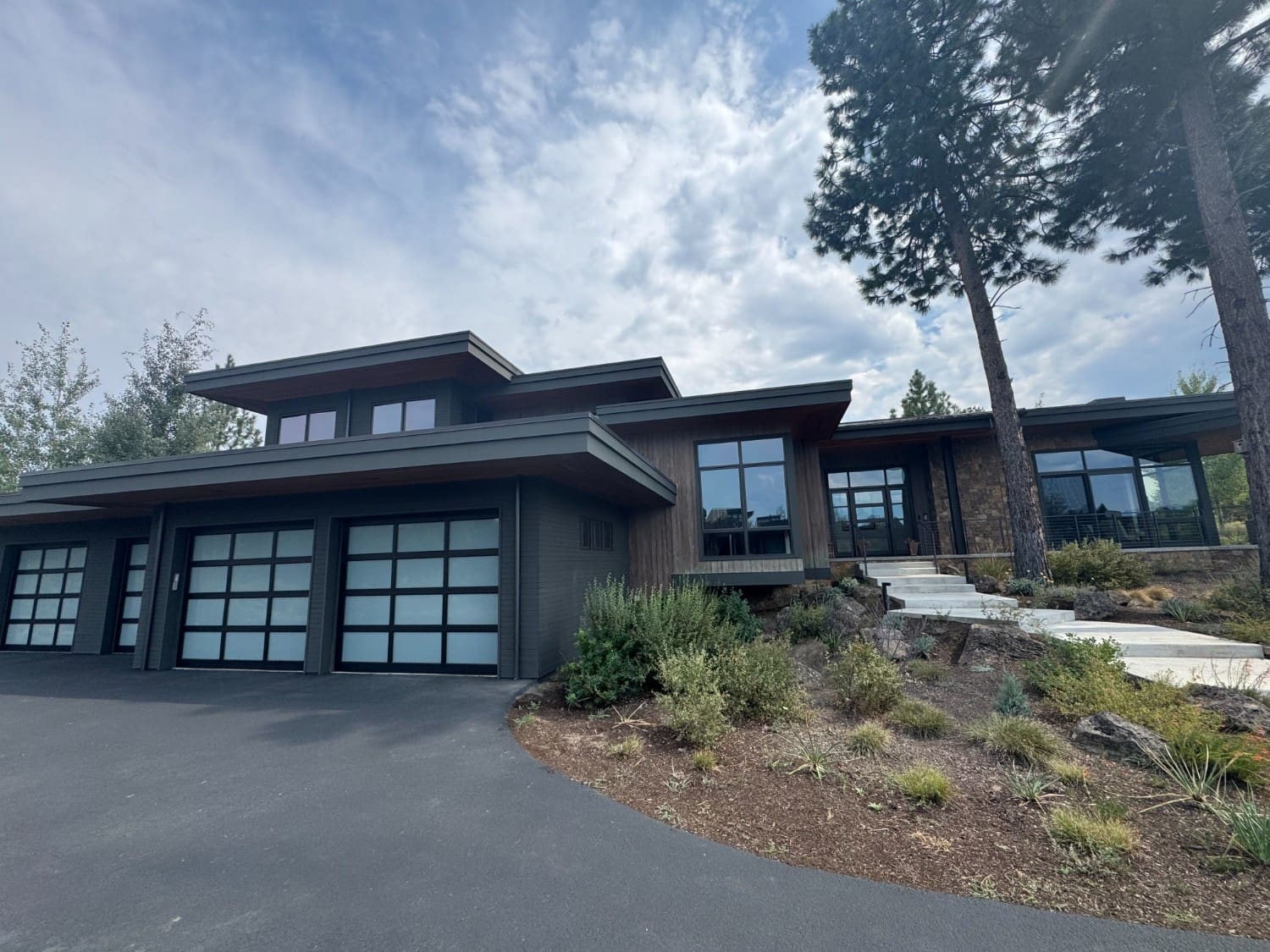 A professional exterior painting and siding renovation on a contemporary residential home in Bend, OR, featuring clean lines, modern finishes, and quality craftsmanship by West Rivers Painting.